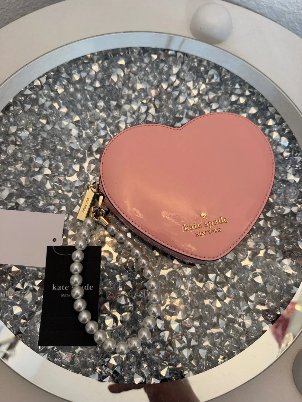 kate spade pink heart-shaped pearl wristlet clutch